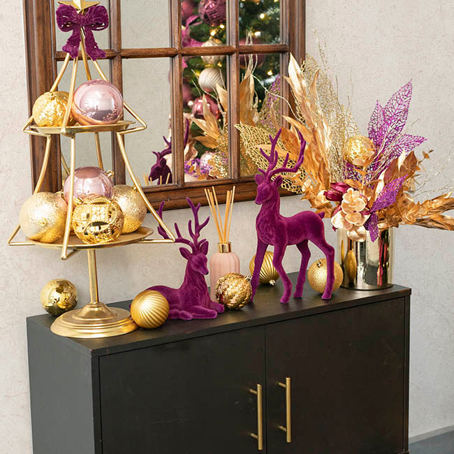 Sitting Flocked Reindeer Plum (18x25cmH)