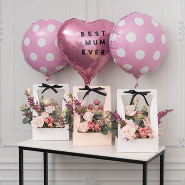  - Flower Carry Box full of hues of pink blooms